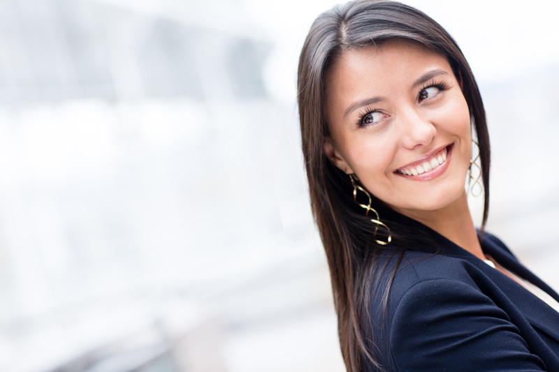 successful-business-woman-looking-back-and-smiling-canstockphoto9797031