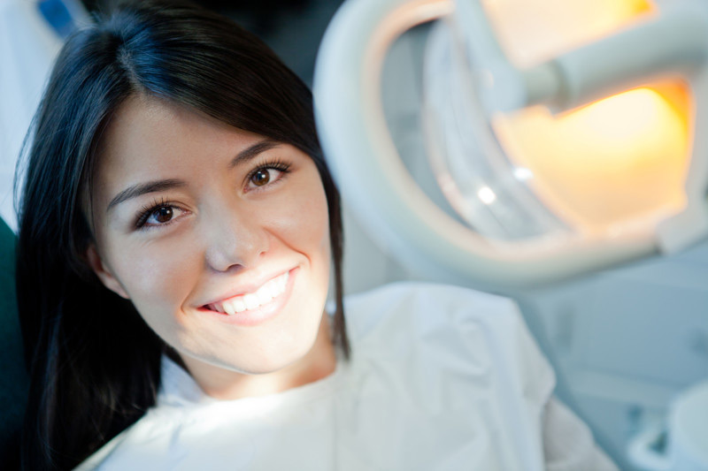 young-woman-visiting-dentist-smiling-canstockphoto8362431