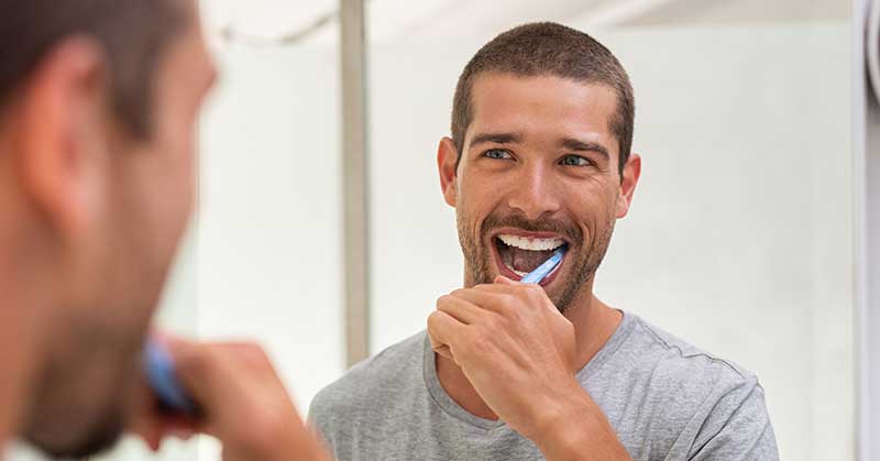 Man brushing teeth Dentist